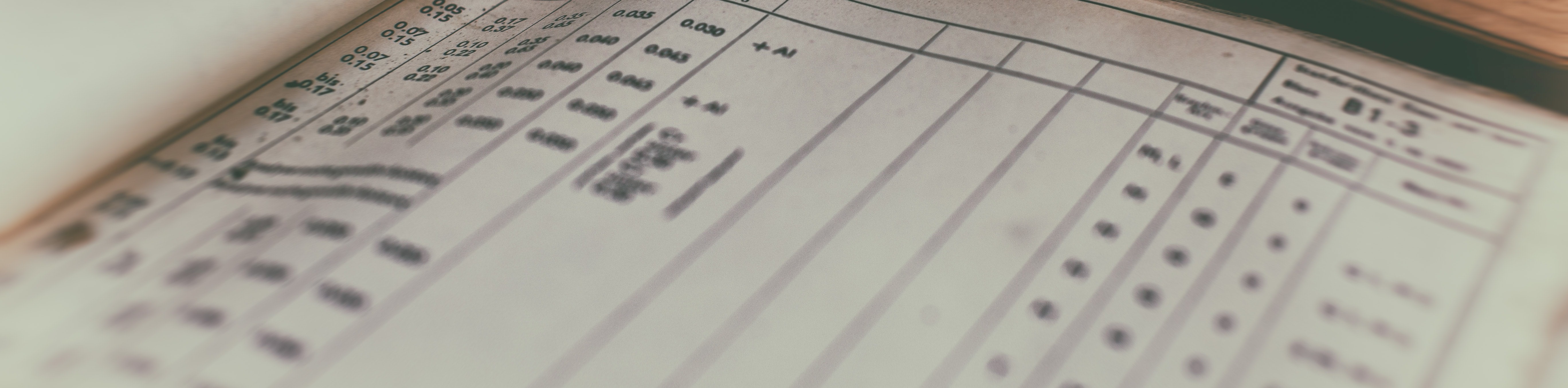 An old book open at a page of statistical tables